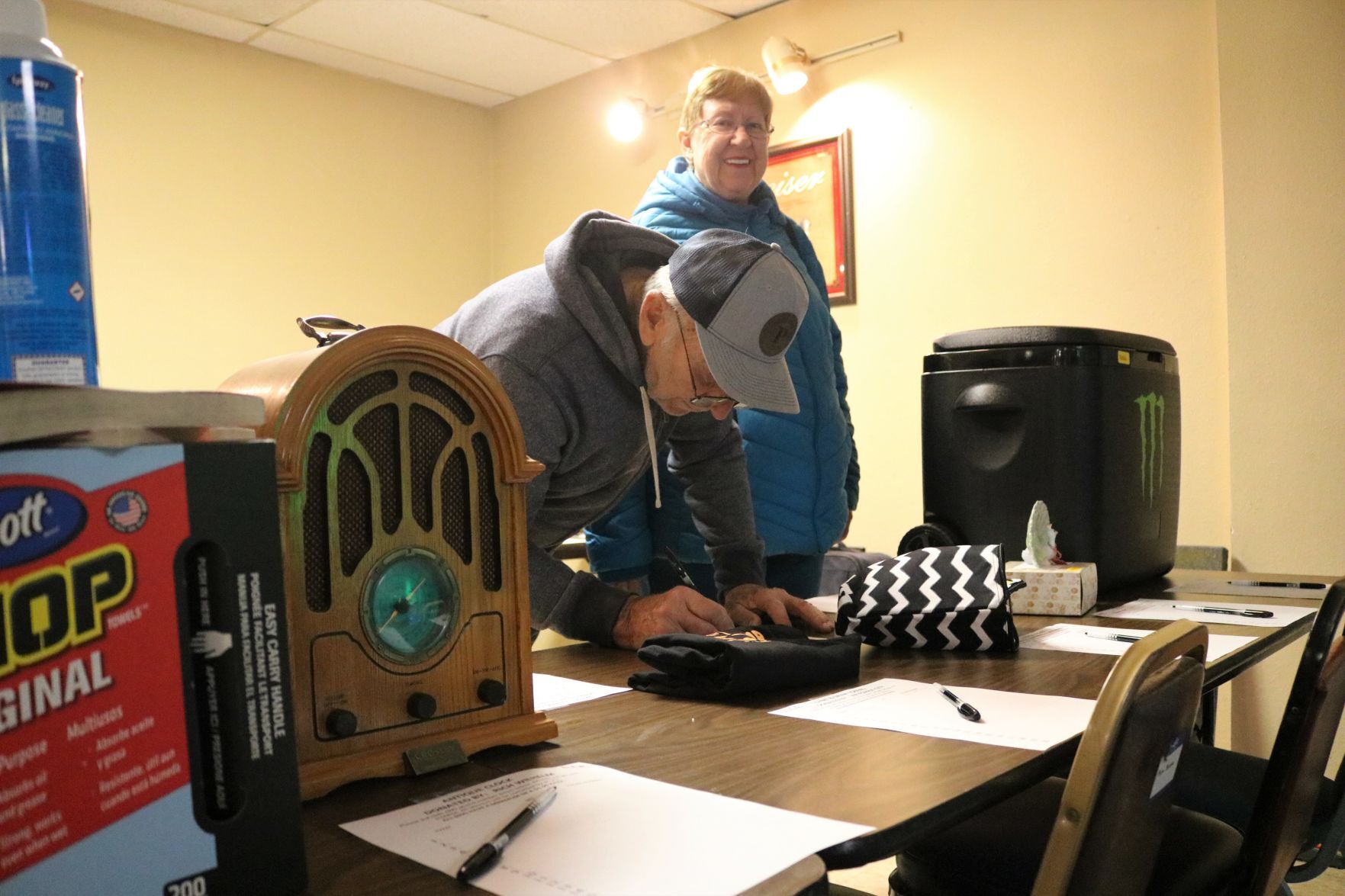 Burnie Korsa of Garner bids on a silent auction item at the Tammy Lenox benefit and concert at Mat's Place on Nov. 20..JPG